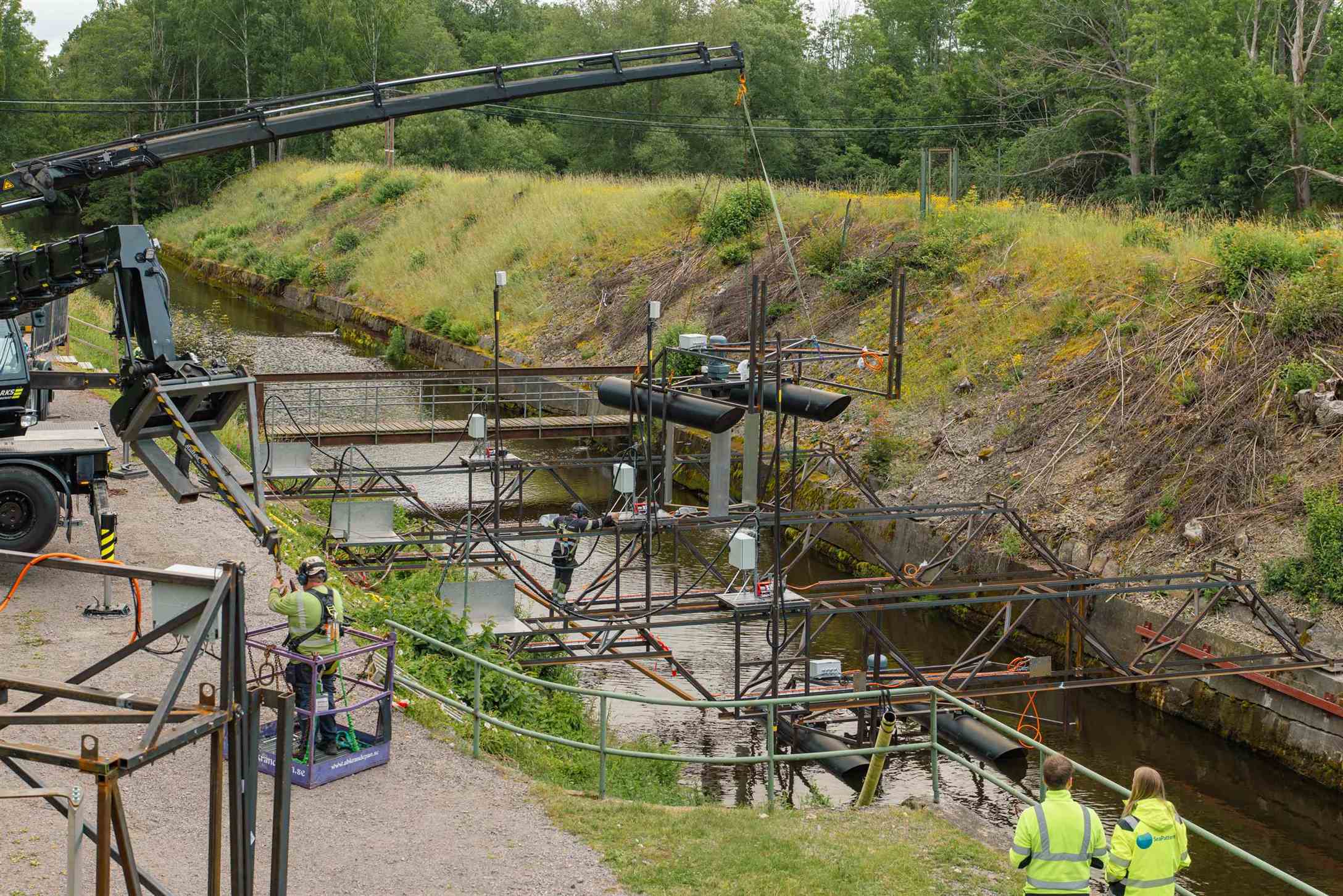 Crane lift of SeaPattern turbines in the canal at the test facility